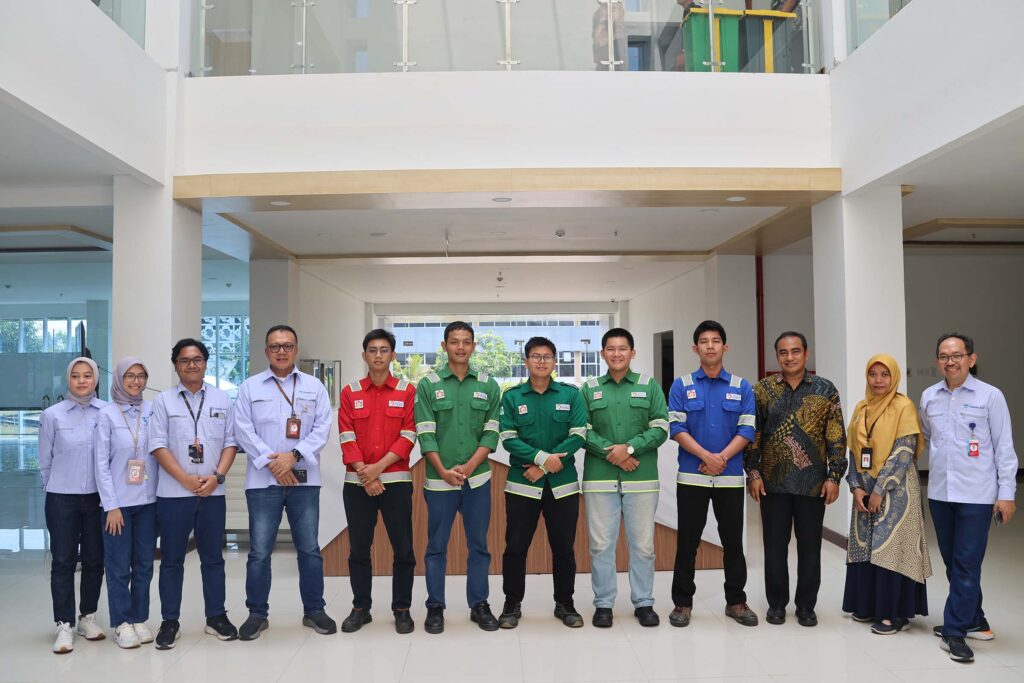 A team photograph taken inside the company's modernized headquarters.